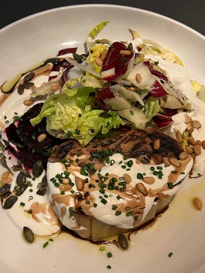Maain course of pasta rotolo of golden and candy beetroots