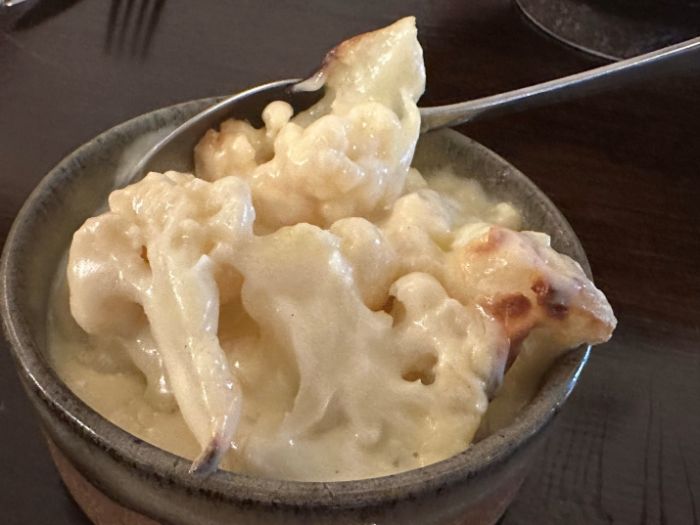 Side dish of cauliflower and Black Bomber cheese Side dish of cauliflower and Black Bomber cheese