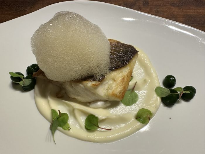 Grilled sea bass topped with an adobo foam Grilled sea bass topped with an adobo foam