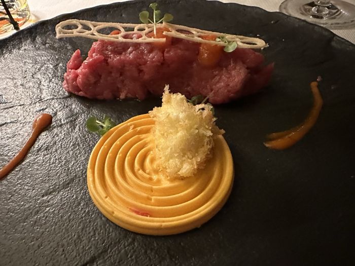 Starter of beef tartare with beer chips