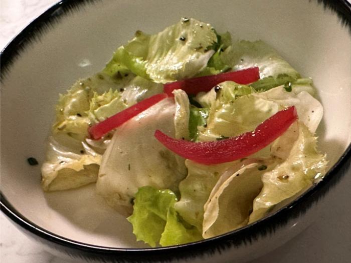 Salad served with the sea bass Salad served with the sea bass