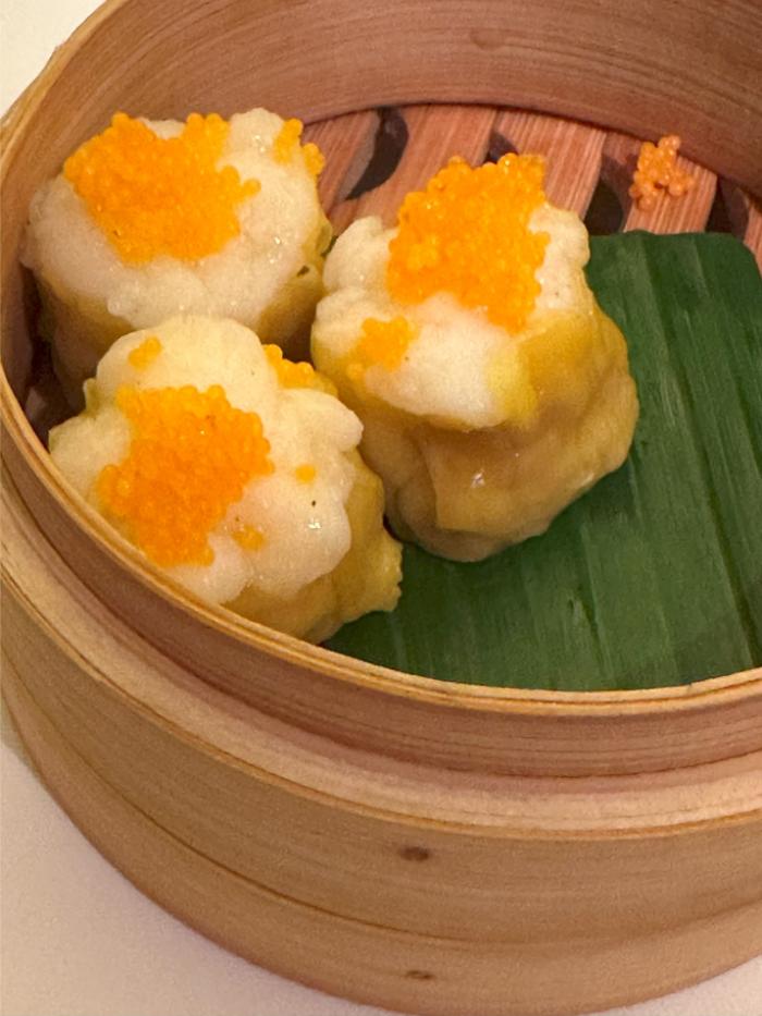 Lobster shumai with tobiko caviar and chicken Lobster shumai with tobiko caviar and chicken