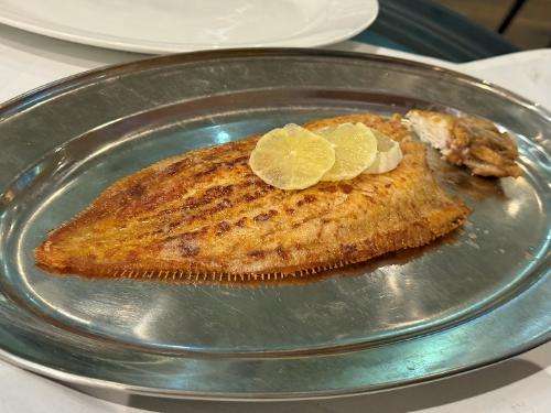 Whole Dover sole served meunière
