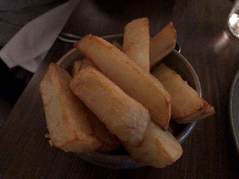 Side dish of hand cut crispy chips Side dish of hand cut crispy chips