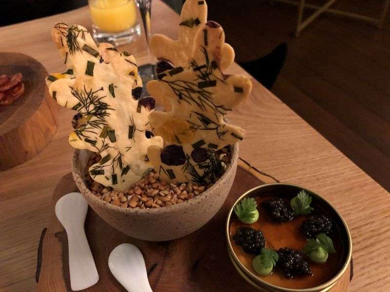 A snack of cod roe, caviar, chicken and parsley