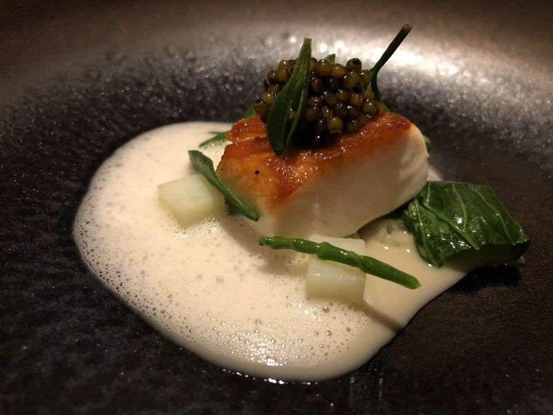 Line-caught halibut, sea herbs, Royal Beluski caviar Line-caught halibut, sea herbs, Royal Beluski caviar