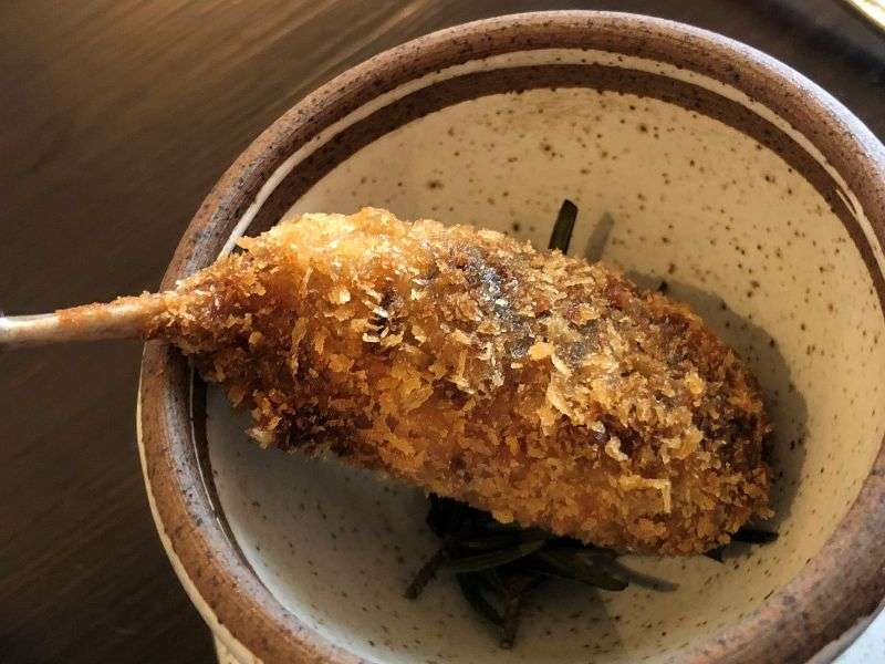 The smoked crispy quail leg