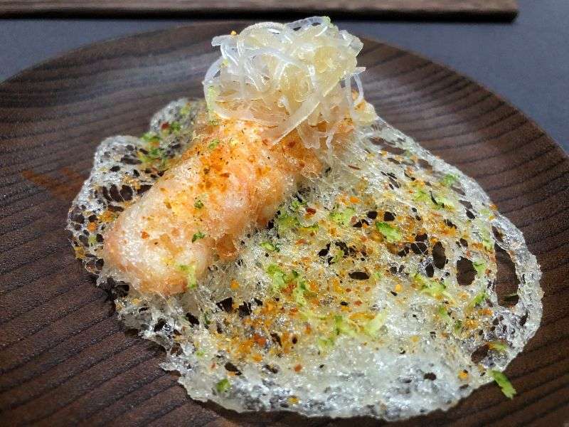 Langoustine tempura served with fresh daikon and a Japanese spice mix