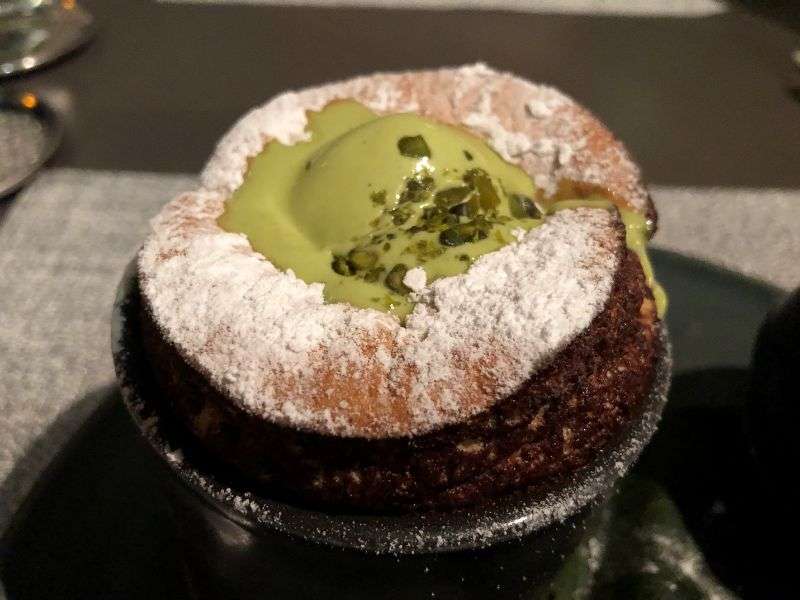 The pistachio ice cream melting into the souffle The pistachio ice cream melting into the souffle